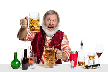 Image showing Expert barman with beer at studio