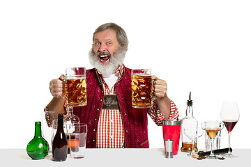 Image showing Expert barman with beer at studio