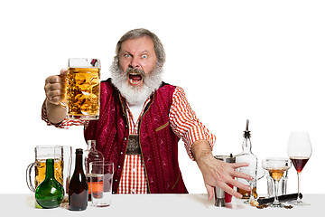 Image showing Expert barman with beer at studio