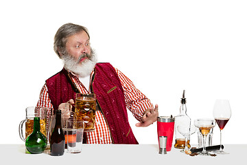 Image showing Expert barman with beer at studio