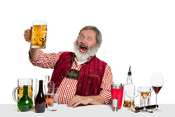 Image showing Expert barman with beer at studio