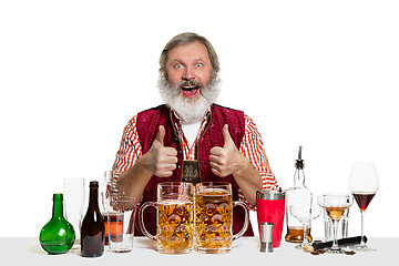 Image showing Expert barman with beer at studio