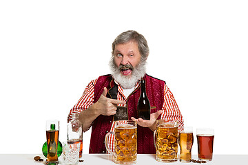 Image showing Expert barman with beer at studio