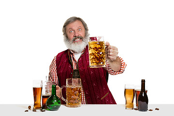 Image showing Expert barman with beer at studio