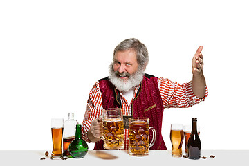 Image showing Expert barman with beer at studio