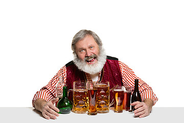 Image showing Expert barman with beer at studio