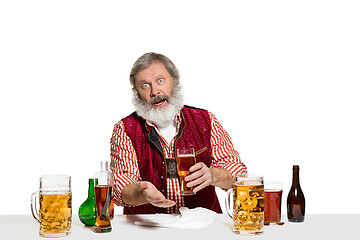 Image showing Expert barman with beer at studio