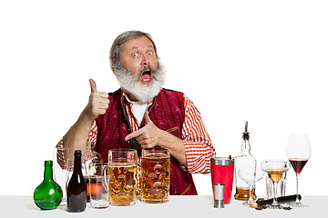 Image showing Expert barman with beer at studio