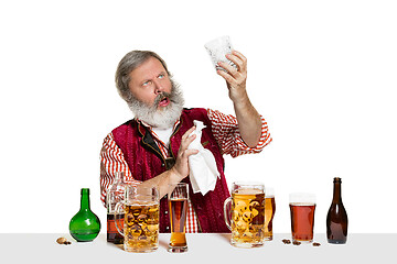 Image showing Expert barman with beer at studio