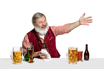 Image showing Expert barman with beer at studio