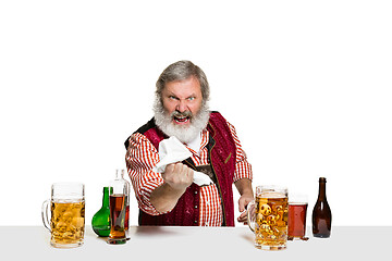 Image showing Expert barman with beer at studio