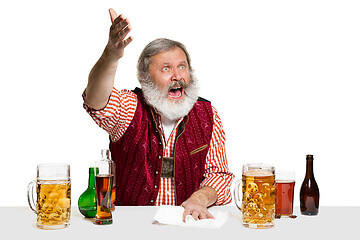 Image showing Expert barman with beer at studio