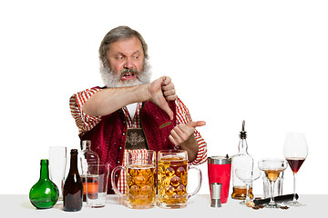 Image showing Expert barman with beer at studio