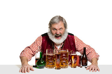 Image showing Expert barman with beer at studio