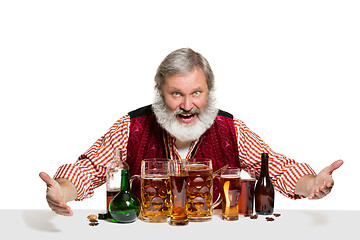 Image showing Expert barman with beer at studio