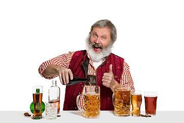 Image showing Expert barman with beer at studio