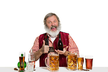 Image showing Expert barman with beer at studio