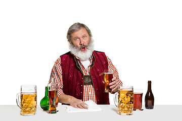 Image showing Expert barman with beer at studio