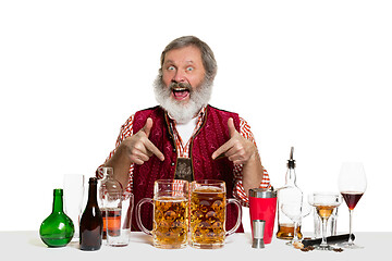 Image showing Expert barman with beer at studio