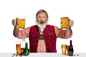 Image showing Expert barman with beer at studio