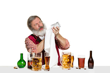 Image showing Expert barman with beer at studio