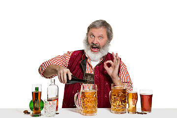 Image showing Expert barman with beer at studio