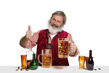 Image showing Expert barman with beer at studio