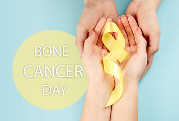 Image showing Yellow ribbon symbolic color for Sarcoma Bone cancer awareness and suicide prevention