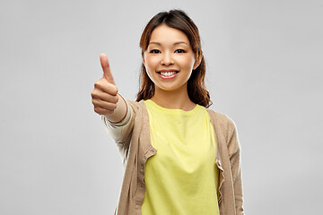 Image showing happy asian woman showing thumbs up