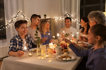 Image showing family with sparklers having dinner party at home