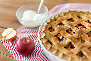 Image showing apple pie with ice cream on wooden table