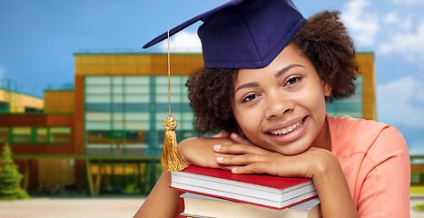 Image showing african american graduate student with books