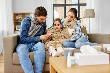 Image showing family with ill daughter having fever at home