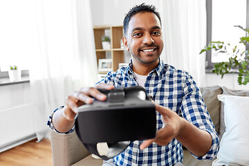 Image showing male blogger with vr glasses videoblogging at home