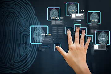 Image showing hand on touch screen scanning fingerprints