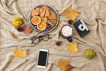 Image showing smartphone, hot chocolate and camera in autumn