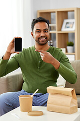 Image showing indian man using smartphone for food delivery