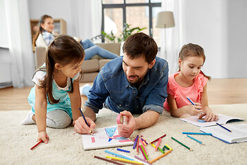 Image showing father spending time with little daughters at home