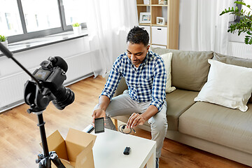 Image showing male blogger with smartphone videoblogging