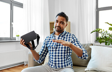 Image showing male blogger with vr glasses videoblogging at home