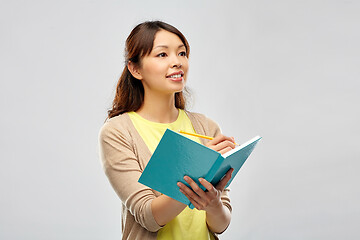 Image showing asian student woman with diary and pencil