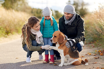 Image showing happy family with beagle dog outdoors in autumn