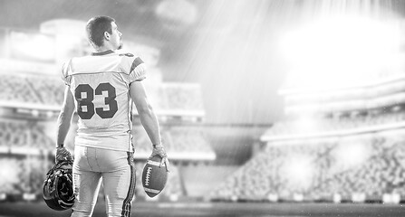 Image showing American Football Player isolated on big modern stadium field