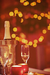 Image showing champagne and glasses at home on christmas night