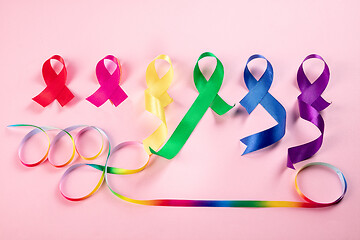 Image showing World cancer dayon February 4. The colorful awareness ribbons on pink background