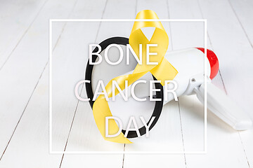 Image showing Yellow ribbon symbolic color for Sarcoma Bone cancer awareness and suicide prevention