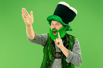 Image showing A man in a leprechaun hat at studio. He celebrates St. Patrick\'s Day.