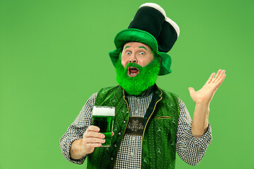 Image showing A man in a leprechaun hat at studio. He celebrates St. Patrick\'s Day.