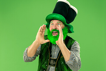 Image showing A man in a leprechaun hat at studio. He celebrates St. Patrick\'s Day.