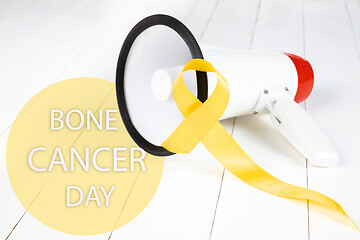 Image showing Yellow ribbon symbolic color for Sarcoma Bone cancer awareness and suicide prevention